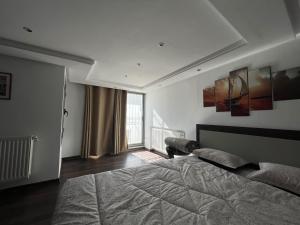 Кровать или кровати в номере Tunisia Queen Apartment