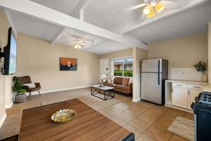 a kitchen and living room with a refrigerator at American Riviera Oasis Close to Beach and Downtown in Santa Barbara