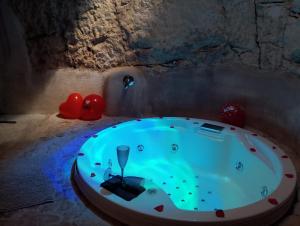 a jacuzzi tub in a stone room with at Amarcord private Spa Ostuni in Ostuni