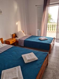 Postel nebo postele na pokoji v ubytování VILLA VRACHOS Preveza