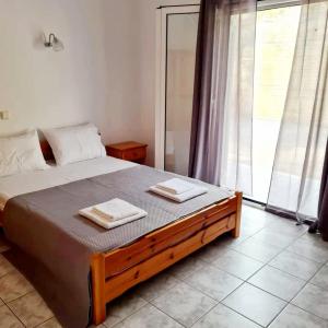 Postel nebo postele na pokoji v ubytování VILLA VRACHOS Preveza