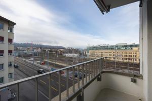 a balcony with a view of a city at Downtown Dream 3,5BR with Balcony and Style BA42 in Zurich