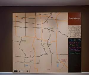 a map hanging on a wall in an airport at TownePlace Suites by Marriott Columbia in Columbia