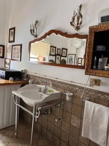 a bathroom with a sink and a mirror at 2 bedrooms house with wifi at Caccamo in Caccamo