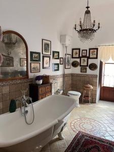 a large bathroom with a tub and a toilet at 2 bedrooms house with wifi at Caccamo in Caccamo