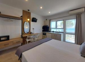 A bed or beds in a room at Sand and Sea