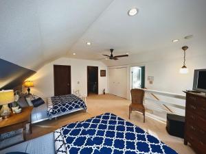 a bedroom with a bed and a ceiling fan at Red Lodge Town Cottage in Red Lodge