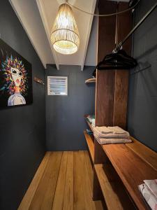 a room with a table and a painting on the wall at La Villa d'à Côté in Le Marin
