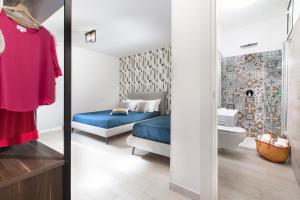 Ένα ή περισσότερα κρεβάτια σε δωμάτιο στο YourHome - Jolly Aranci