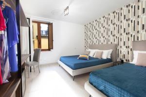 Ένα ή περισσότερα κρεβάτια σε δωμάτιο στο YourHome - Jolly Aranci
