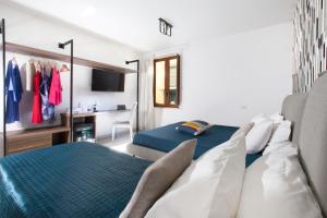 Ένα ή περισσότερα κρεβάτια σε δωμάτιο στο YourHome - Jolly Aranci