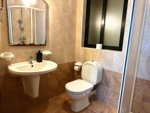 a bathroom with a toilet and a sink at Holiday Home in St. Paul’s Bay in St Paul's Bay