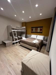 a bedroom with two beds and a bunk bed at Esposito House in Sarno
