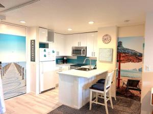a kitchen with a kitchen island in a kitchen with a dock at Beachside Retreat in Oceanside