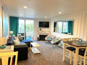 a living room with a couch and a table at Beachside Retreat in Oceanside