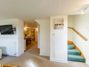 a living room with a couch and a tv at 3 Bed in Pickering 88958 in Newton