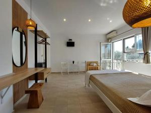 A bed or beds in a room at Sand and Sea