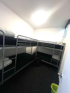 a room with bunk beds in a dorm room at K Road City Travellers in Auckland