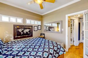 a bedroom with a bed and a ceiling fan at Desert Beauty in Phoenix