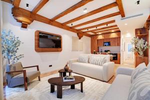 a living room with a white couch and a table at Luxury apartment in the heart of PARIS in Paris