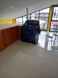 a bag of luggage sitting on the floor of a building at Close to Everything in Port-of-Spain