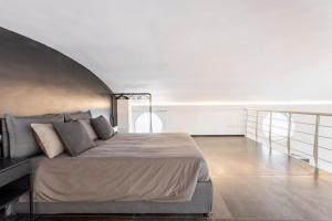 a bedroom with a large bed in a room at Diaz Novantuno - Luxury Apartments Como City Center in Como