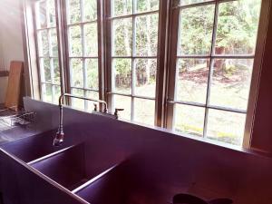 a kitchen with a sink and a large window at Large Lodge at Rainier Lodge (0.4 miles from entrance) in Ashford