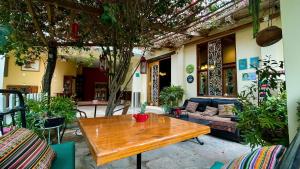 a wooden table in the middle of a patio at Serenity hotel & lodge in Ica