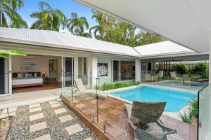 an image of a house with a swimming pool at Belle Escapes - Namaste, Oasis in Palm Cove in Palm Cove