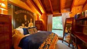 a bedroom with a bed with a poster on the wall at Inn Wine Country - Summers House in Sonoma +22 photos