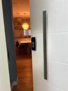 a refrigerator in a room with a kitchen at Casa na Árvore in Salvador