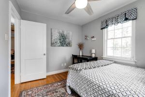 a bedroom with a bed and a window at LG Central location FREE parking fenced yard FIRE-PIT in Richmond +24 photos