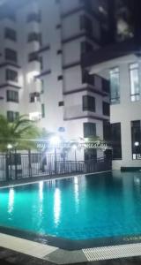 a large swimming pool in front of a building at My Dallyne's Homestay at The Heights Residence, Ayer Keroh, Melaka in Ayer Keroh