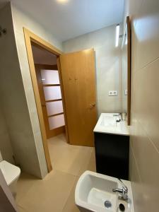 a small bathroom with a sink and a toilet at Estancias mensuales Terrassa in Terrassa