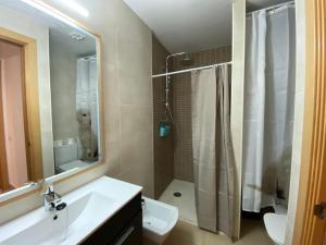 a bathroom with a sink and a toilet and a shower at Estancias mensuales Terrassa in Terrassa