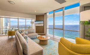 a living room with a view of the ocean at Novotel Surfers Paradise in Gold Coast