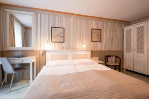 Ένα ή περισσότερα κρεβάτια σε δωμάτιο στο Hotel Maxant