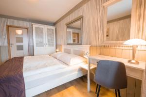 Ένα ή περισσότερα κρεβάτια σε δωμάτιο στο Hotel Maxant