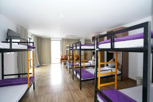 a dorm room with several bunk beds in it at Thanh Măng Hotel in Quang Ninh