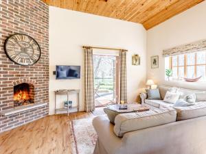 a living room with a couch and a fireplace at 2 bed in Dorchester 75243 in Frampton