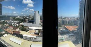 a view of a city from a window at Condo near Ateneo and Royal Mandaya in Davao City