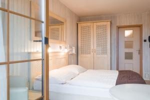Ένα ή περισσότερα κρεβάτια σε δωμάτιο στο Hotel Maxant