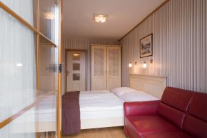 Ένα ή περισσότερα κρεβάτια σε δωμάτιο στο Hotel Maxant