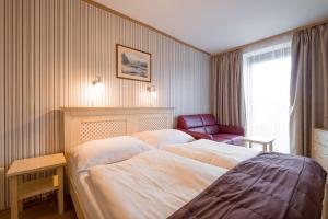 Ένα ή περισσότερα κρεβάτια σε δωμάτιο στο Hotel Maxant