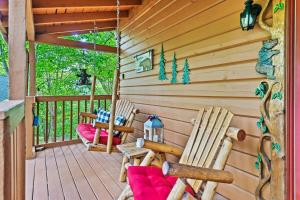 two rocking chairs sitting on a porch of a cabin at New! Cozy, ADA Accessible, Family Cabin w/ Hot Tub in Sevierville