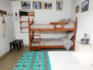 a bedroom with two bunk beds and a bed at La Posadita Familiar in Yerba Buena