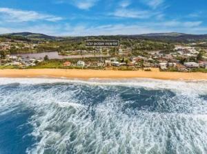 an aerial view of a beach in front of a resort at Terrigal Coastal Casa in Wamberal