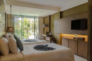 TV a/nebo společenská místnost v ubytování Wyndham Tamansari Jivva Resort Bali