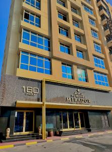 a tall building with a sign on the front of it at MIRADOR HOTEL in Manama