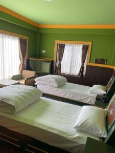 Hotel De Purang客房内的一张或多张床位